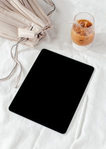 Picture of an ipad with coffee showing Essential work from home items