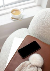Image of cell phone sitting on a couch for Pinterest