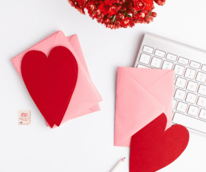Image of paper Valentine's sitting on a desk. Showing creating valentine's that are homemade as things to do on valentine's day.