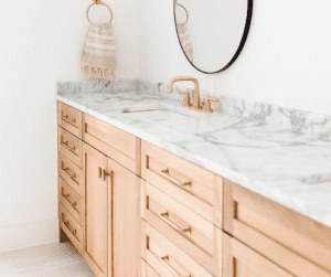 Image of bathroom sink and cupboards to show how to organize under the bathroom sink.