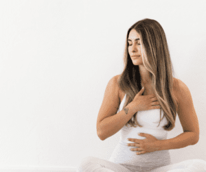 Image of woman sitting and performing stretches to help with how to recover from illness.
