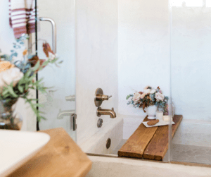 Image of a bath being drawn and a shower handles to show taking a shower to help recover from illness.