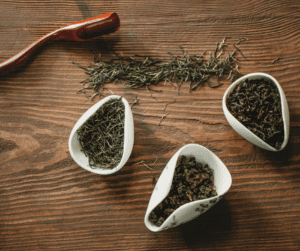 Image of dried tea leaves, showing green tea leaves as one of the best tea for menstrual cramps.