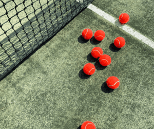 Image of red tennis balls for sport date ideas.
