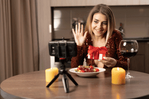 Image of woman sharing romantic dinner over video call as sweet things to do in a long distance relationship.