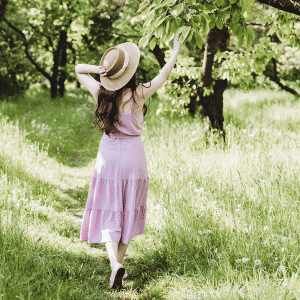 Image of women walking in park in the summer heat. 