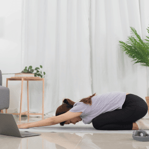 Image of woman doing yoga poses for period pain. 