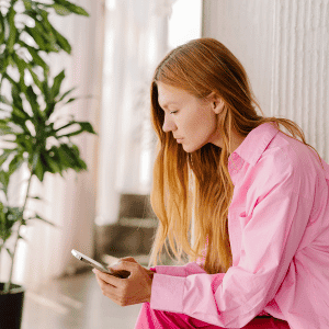 Image of woman working on content marketing on phone. 