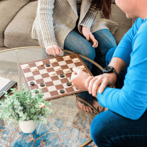 Image of couple playing board games for date ideas for winter.